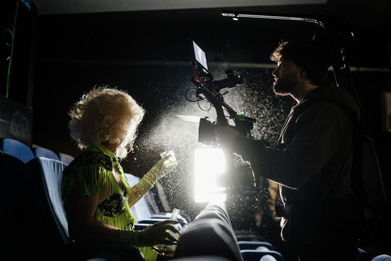 Rene filmmaker on set with camera gear